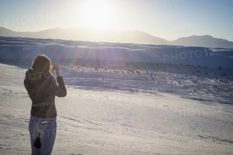 Caucasian woman photographing White Sands National Park