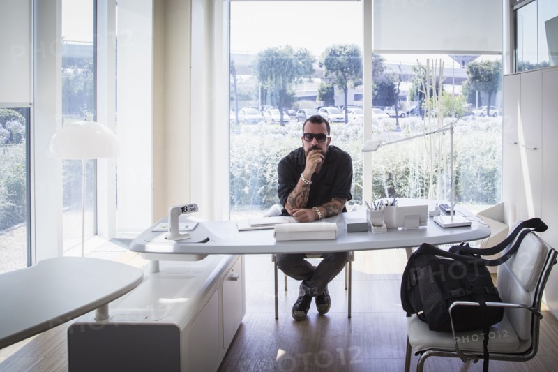 Caucasian businessman sitting in modern office