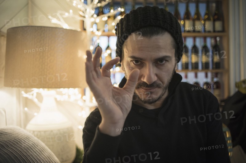 Caucasian man demonstrating size with fingers