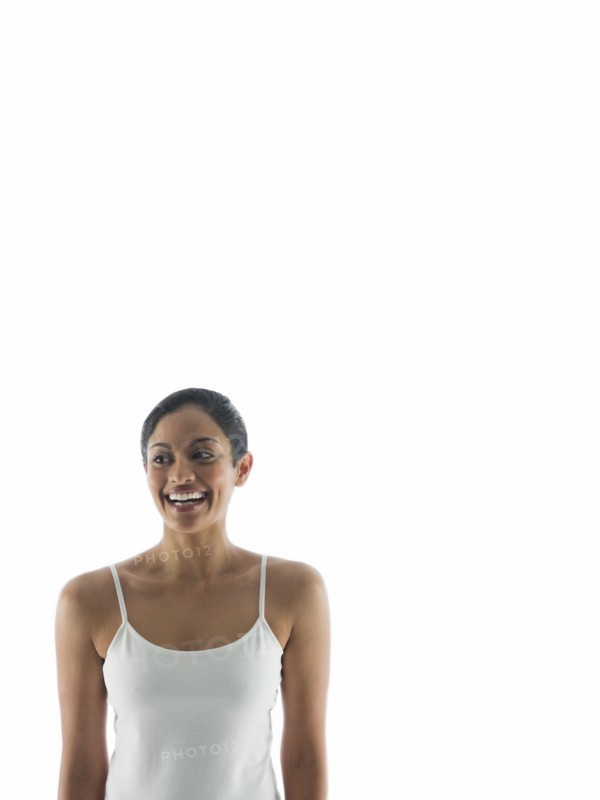 Waist up view of smiling woman standing
