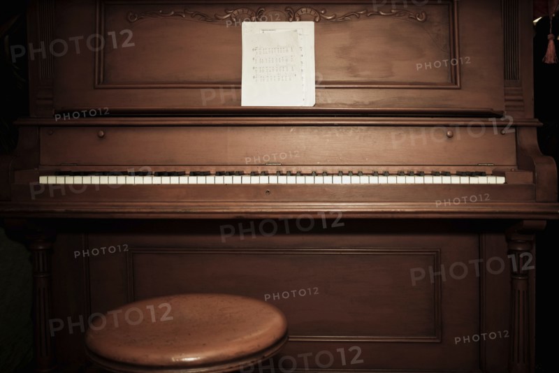 Empty piano with sheet music