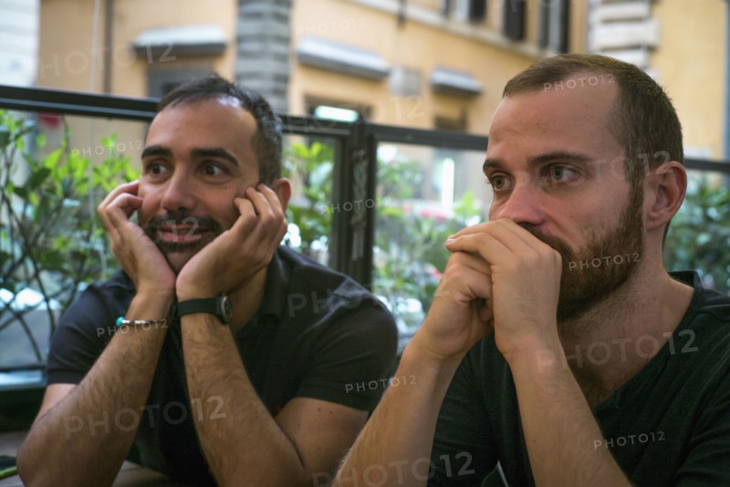 Caucasian men sitting in cafe