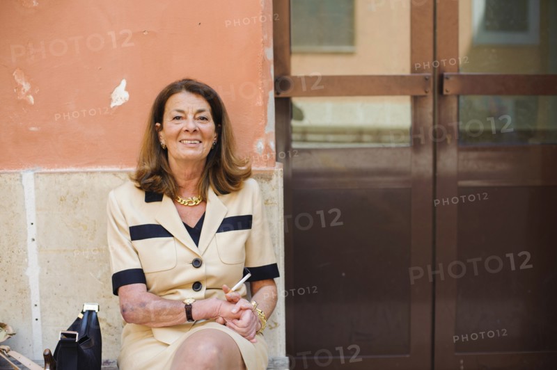 Caucasian woman sitting outdoors