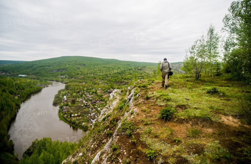 Caucasian man hiking in remote landscape