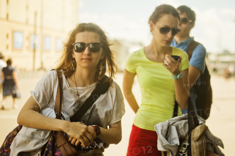 Caucasian women carrying bags outdoors