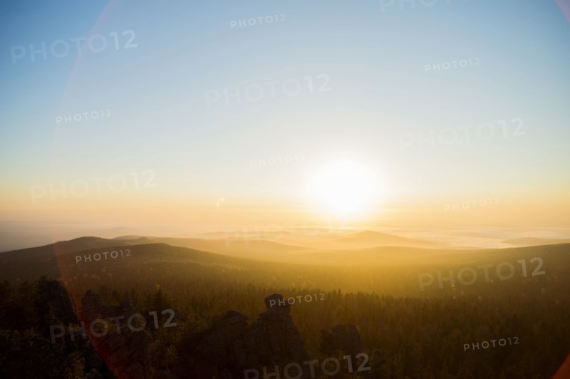 Sunrise over hills in remote landscape