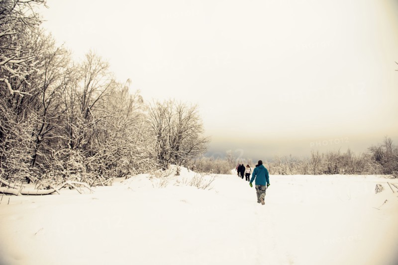 Caucasian hikers walking in snow