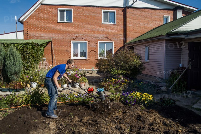 Caucasian man working in garden