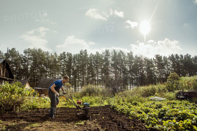 Caucasian man working in garden