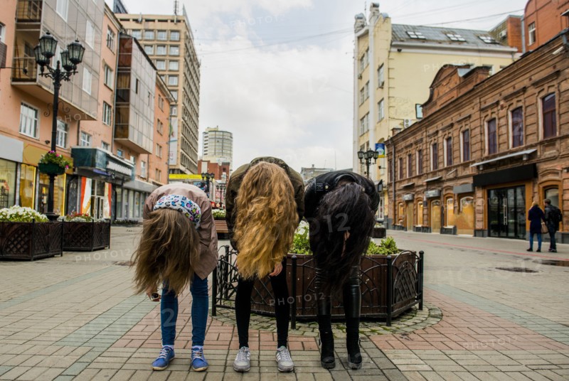 Caucasian women posing outdoors