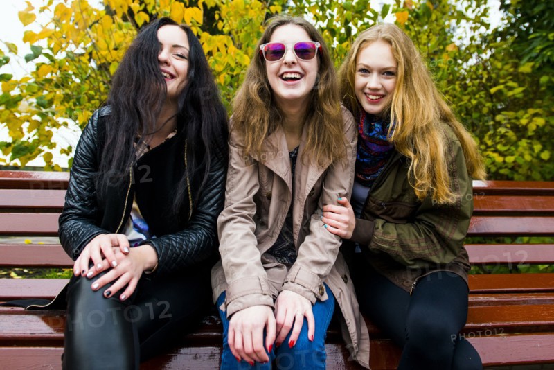 Caucasian women smiling on bench