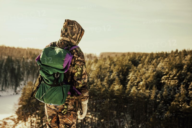 Caucasian hiker standing on hilltop