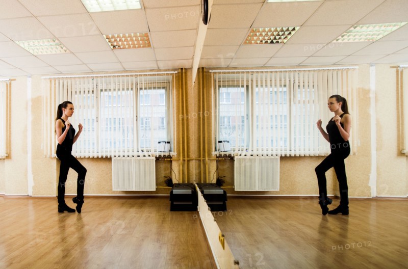 Caucasian dancer practicing in studio