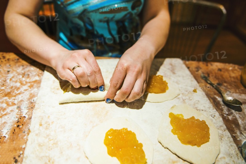 Close up of woman forming dumplings