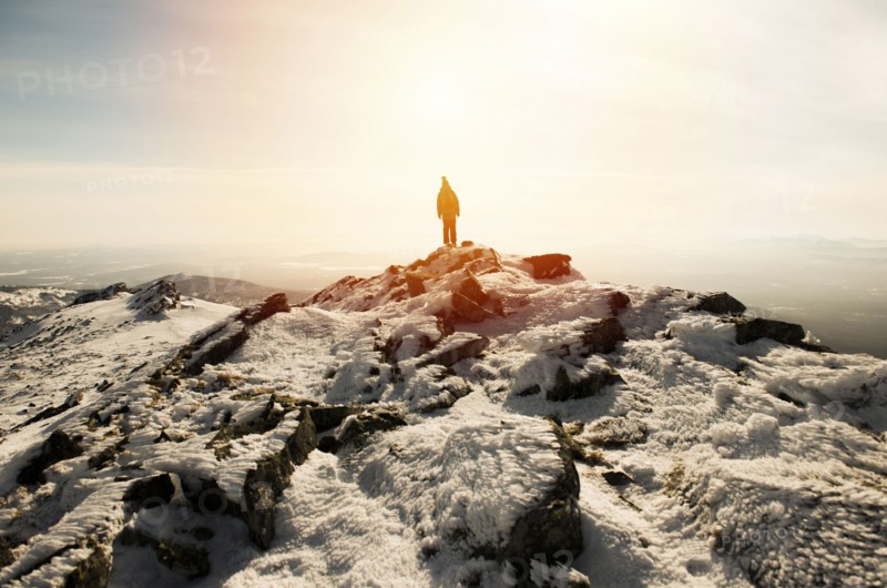 Woman hiking on mountain in winter