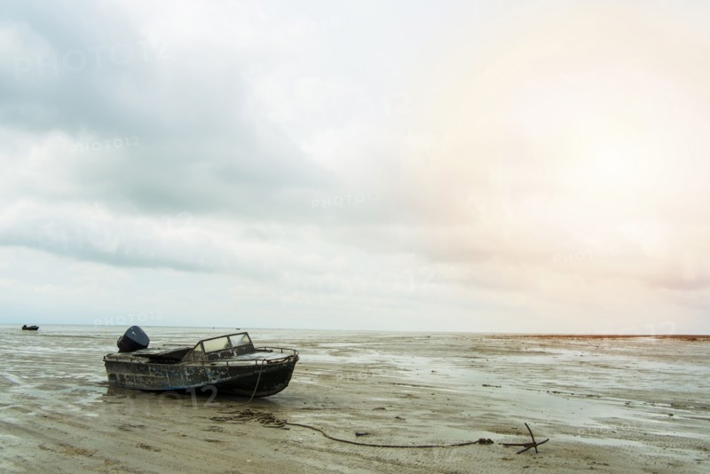 Boat on beach at low tide