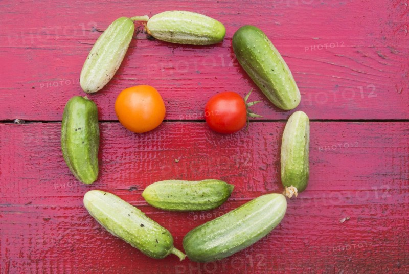 Cucumbers and tomatoes arranged in smiley face