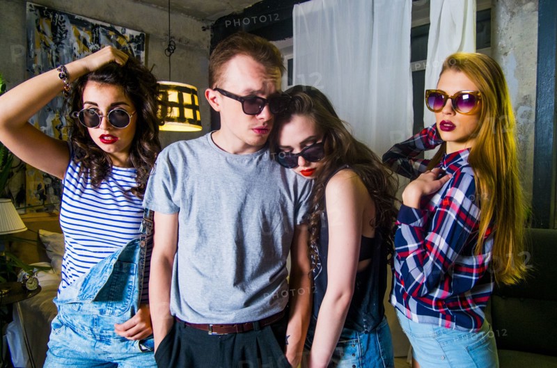 Portrait of serious fashionable Caucasian friends