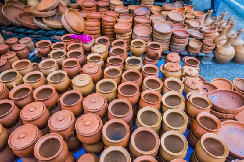 Clay pots and bowls on floor