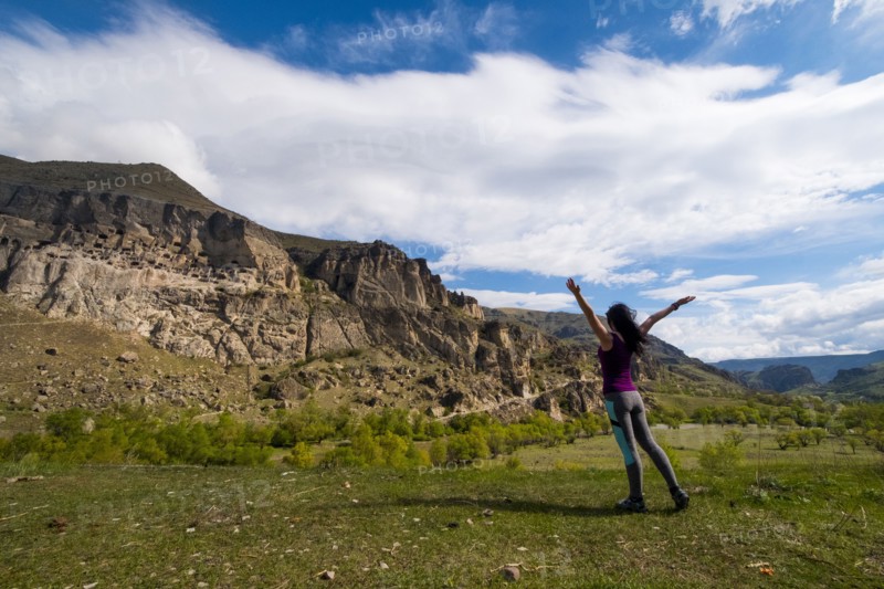 Carefree Caucasian woman admiring mountains
