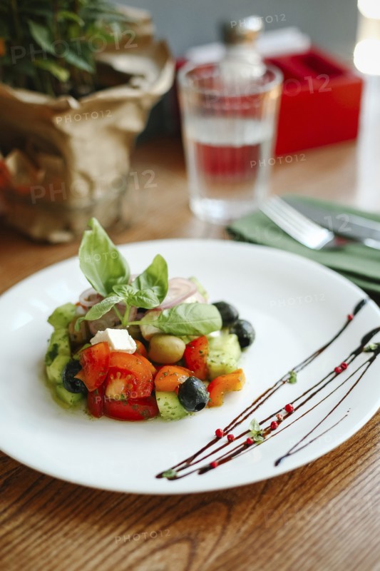 Gourmet salad on plate with sauce