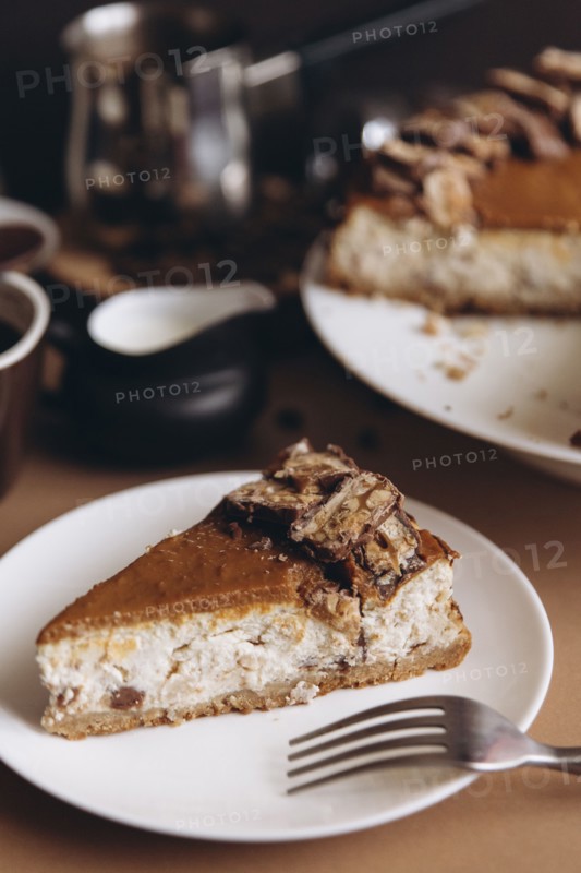 Slice of cheesecake on plate with fork