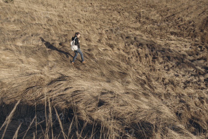 Middle Eastern woman walking on hill