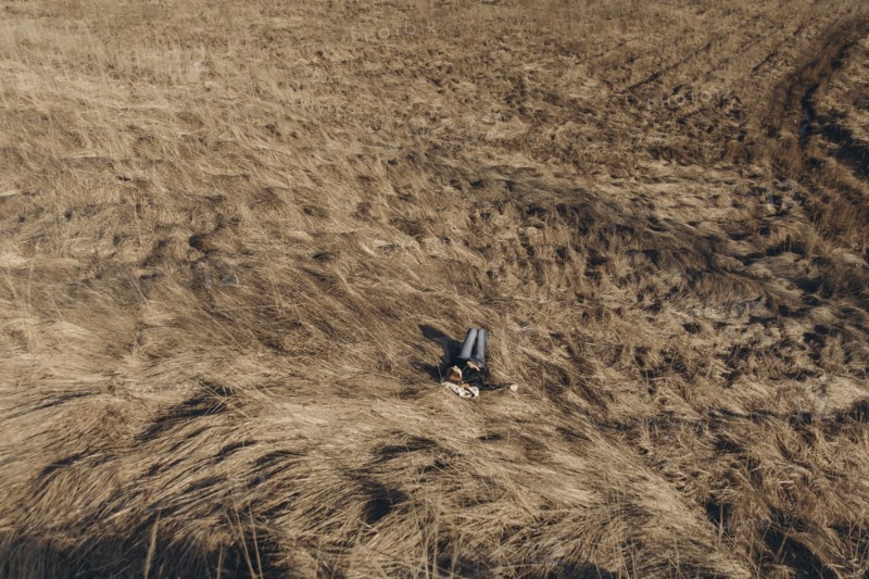 Middle Eastern woman resting on hill