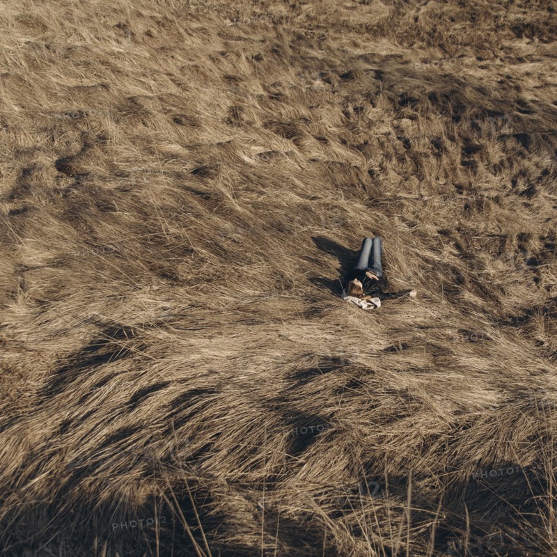 Middle Eastern woman resting on hill