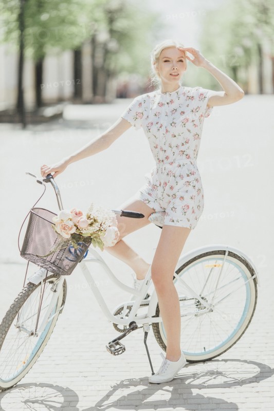 Middle Eastern woman sitting on bicycle