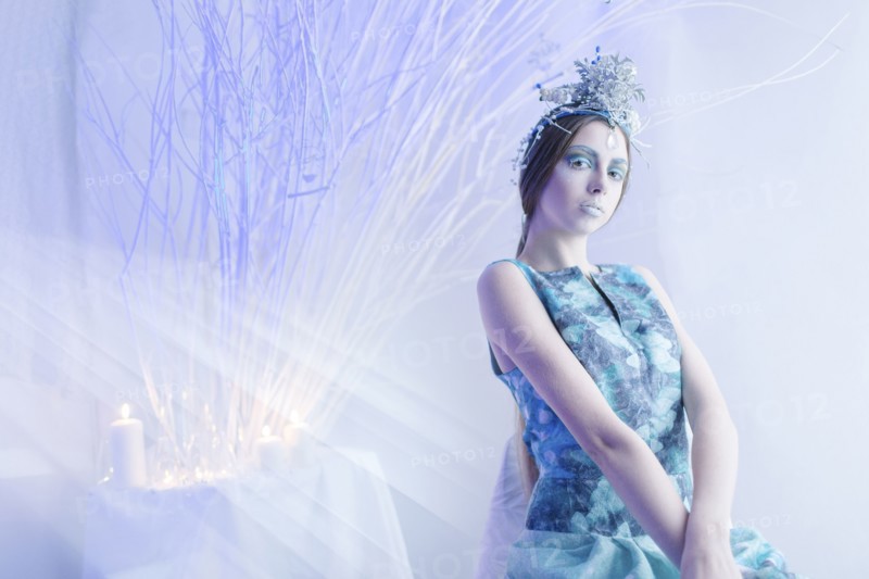 Ethereal woman wearing blue dress and makeup