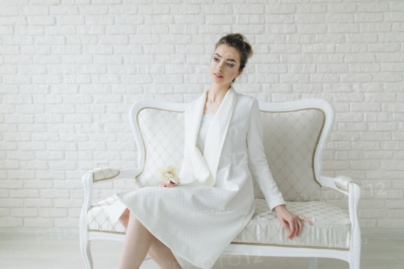 Portrait of glamorous Middle Eastern woman sitting on bench