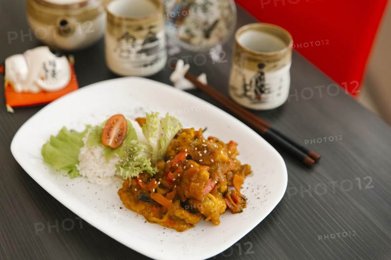 Chopsticks near plate of food