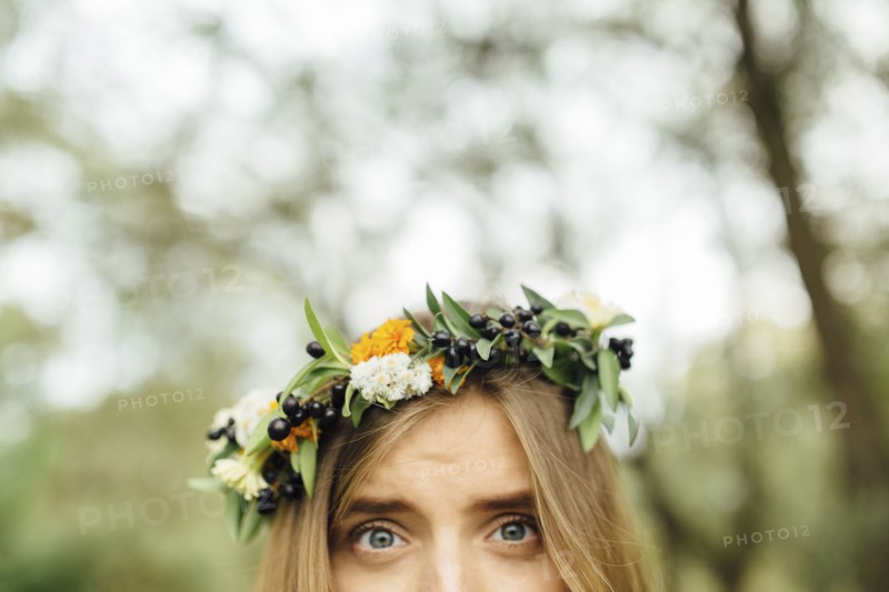 Eyes of Middle Eastern woman wearing flower crown