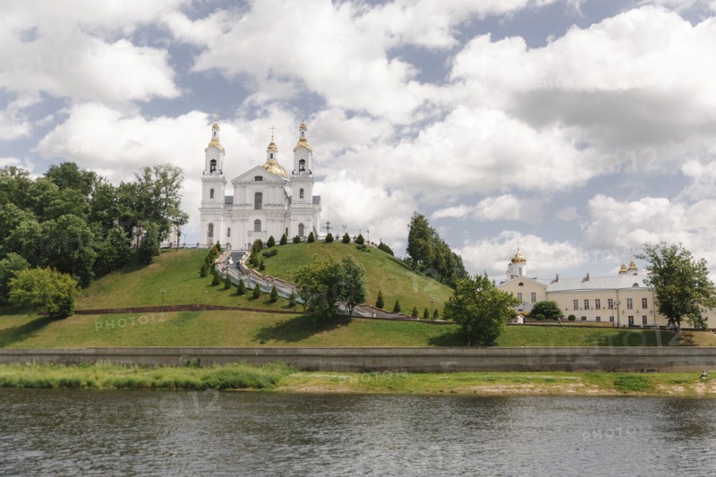 Scenic view of castle on hill near river