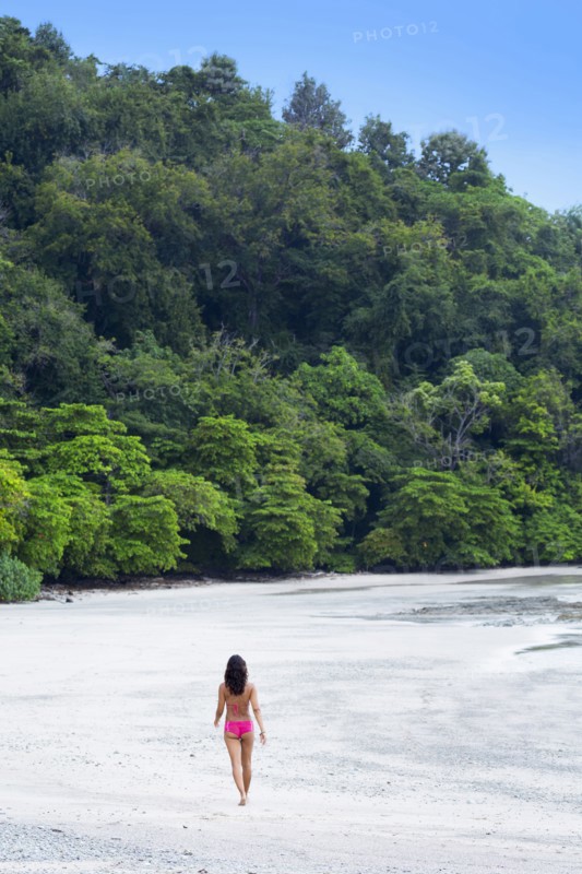Woman walking on beach