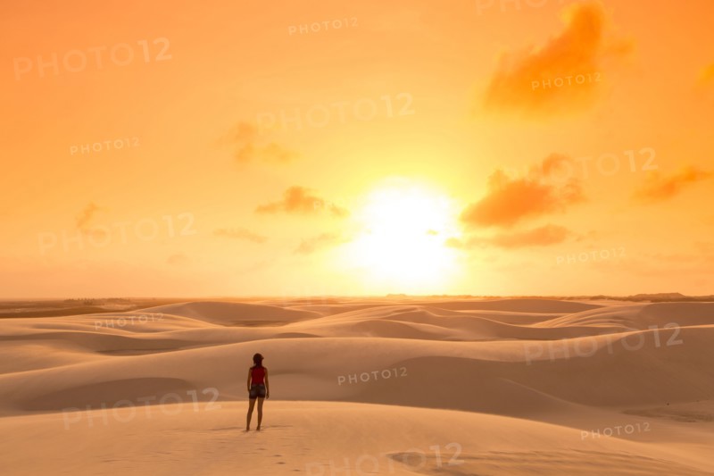 Mixed race teenage girl standing in remote desert