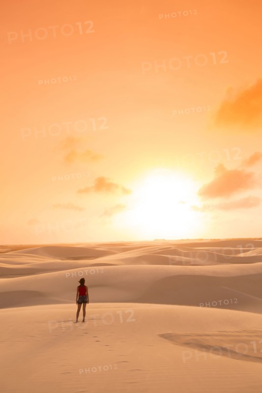 Mixed race teenage girl standing in remote desert