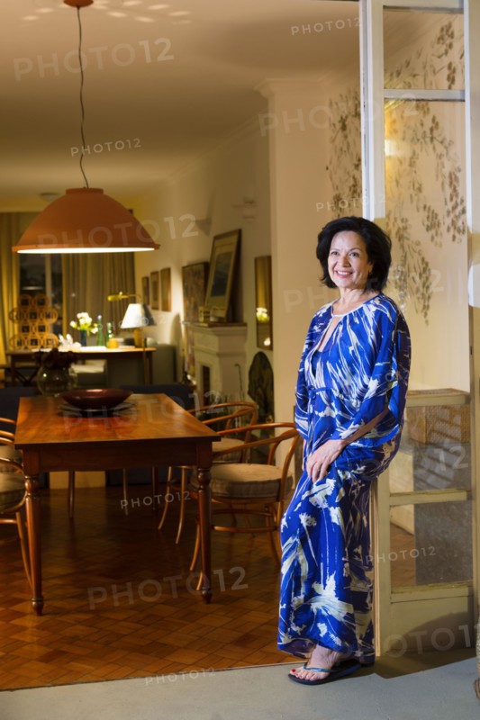 Caucasian woman smiling in dining room