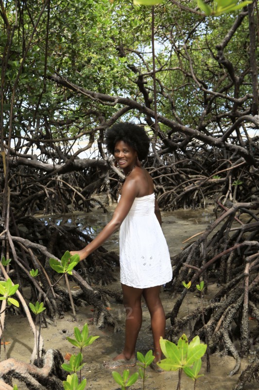 Black woman smiling in mangrove jungle