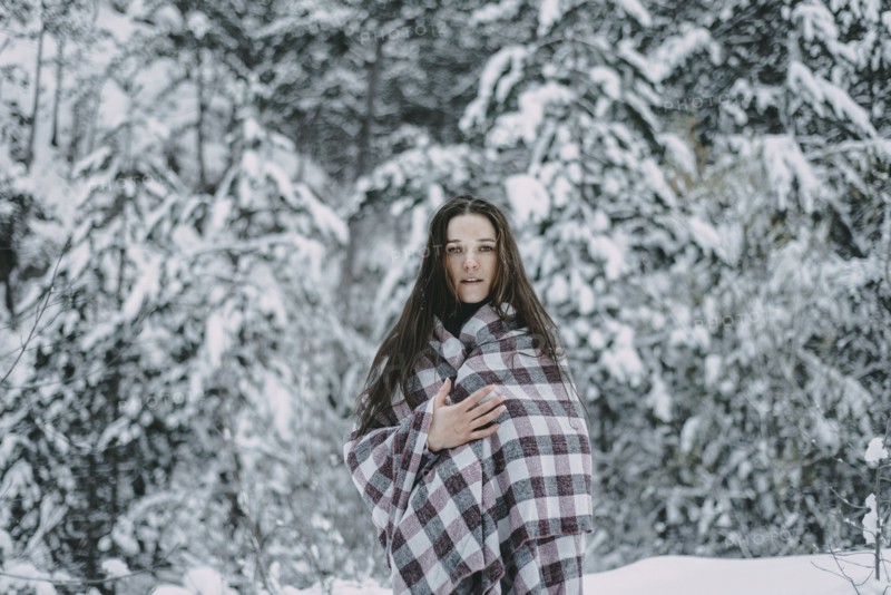 Portrait of Caucasian woman in snowy forest