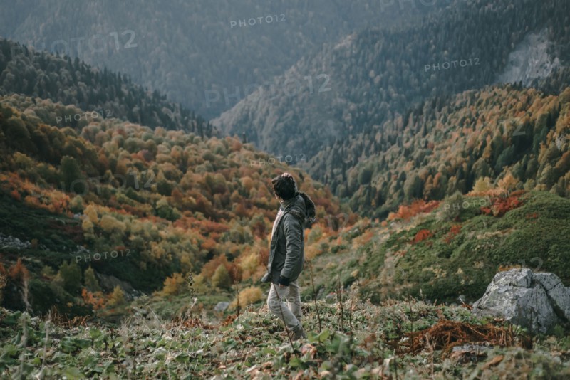 Caucasian man walking in valley