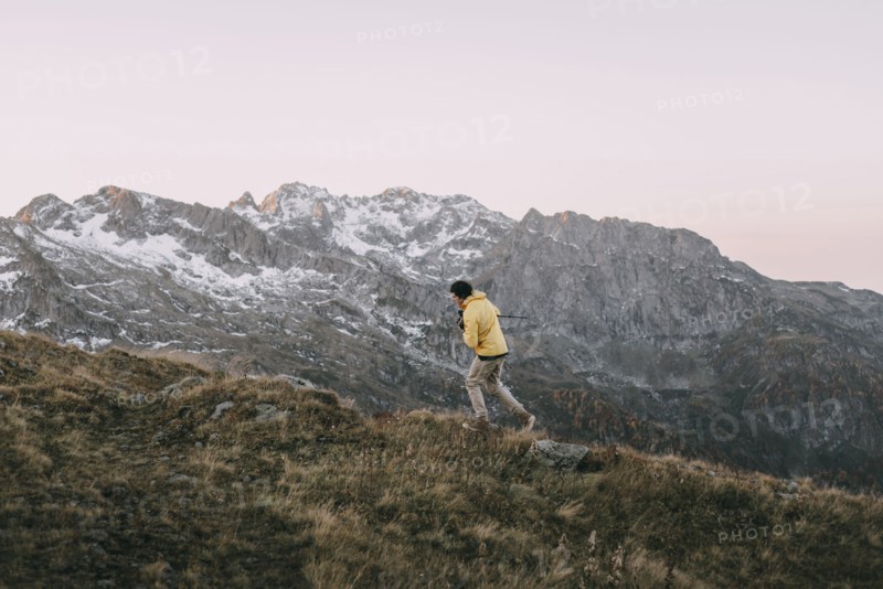 Caucasian man hiking in remote mountain landscape