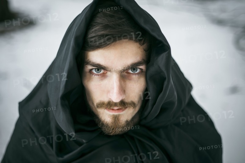 Caucasian man with beard wearing robe in winter