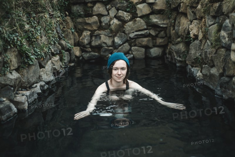 Portrait of smiling Caucasian woman wearing stocking-cap swimming