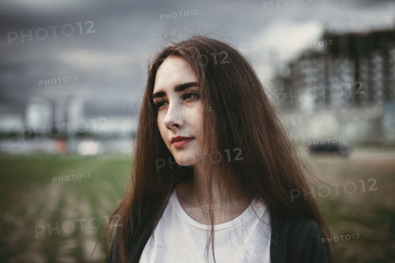 Pensive Caucasian woman outdoors