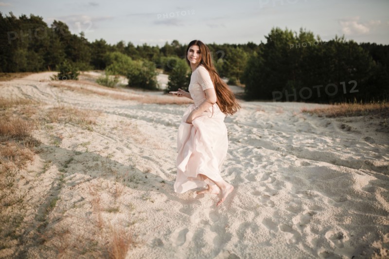 Caucasian woman running on beach
