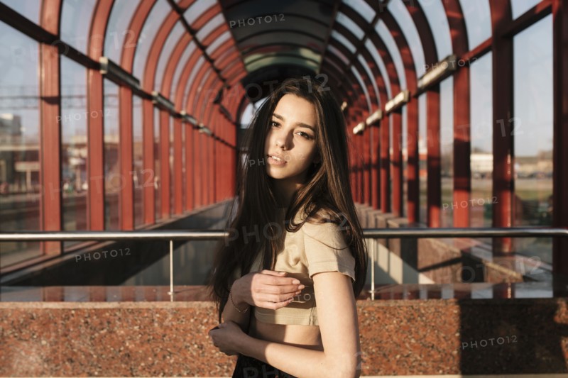 Portrait of Caucasian woman near arches outdoors