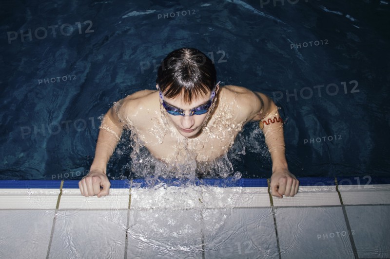 Caucasian man wearing goggles in swimming pool