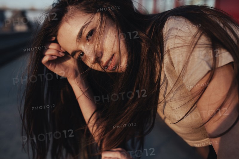 Wind blowing hair of Caucasian woman